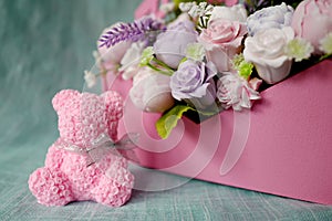 Bouquet of soap flowers and pink rose bear