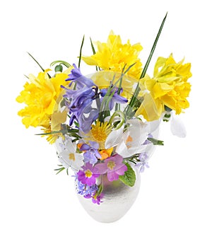 Bouquet of spring flowers in a vase, Easter composition, on an isolated white