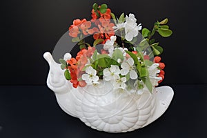 Bouquet of spring flowers in a white vase