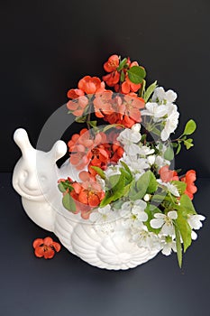 Bouquet of spring flowers in a white vase