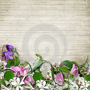 Bouquet of spring flowers on a wooden vintage background