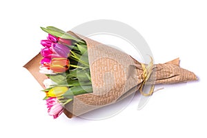 Bouquet of spring tulips flowers wrapped in paper