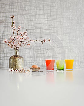 Bouquet style white kitchen table set up with yellow and green cups