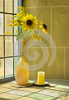 Bouquet of summerflowers in front of a sunlit wind