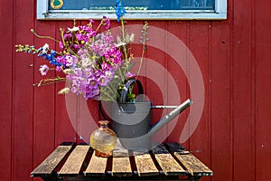 bouquet of summerflowers stillife on a outdoor table photo