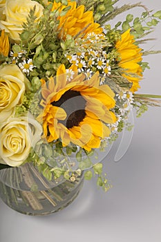 Bouquet of sunflowers, roses and wildflowers