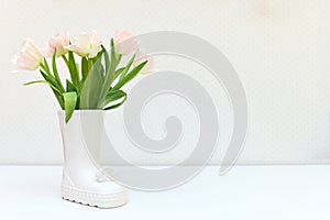 bouquet of tulips and Easter bunny on white table