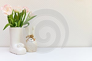 bouquet of tulips and Easter bunny on white table