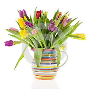 Bouquet tulips in vase with stripes