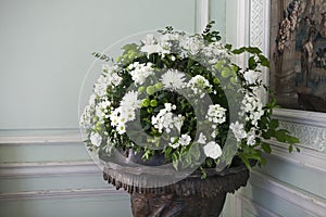 The bouquet of white chrysanthemums in interior