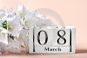 Bouquet of white flowers, calendar with date 08 march on pink background Holiday greeting card International womens day