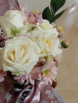 bouquet of white roses, serunai and roscus leaves