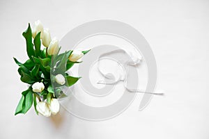 Bouquet of white tulips and accessories