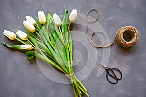 Bouquet of white tulips and accessories