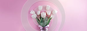 Bouquet of white tulips flowers on pink background. Card for Mothers day, 8 March, Happy Easter. Waiting for spring