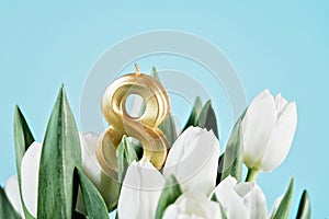 Bouquet of white tulips on light blue background. Mothers day,