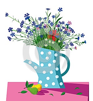 Bouquet of wild flowers in a blue teapot standing on the table.