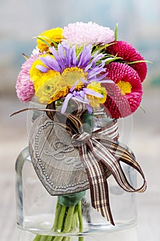Bouquet of wild flowers in glass vase