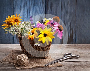 Bouquet of wild flowers scissors vintage board