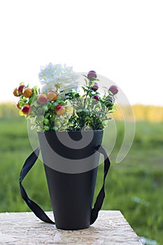 Bouquet of wild flowers at sunset in the field.