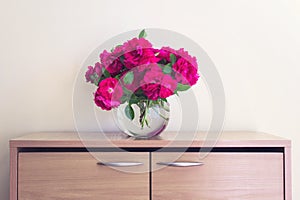 Bouquet of wild tea roses in ball glass