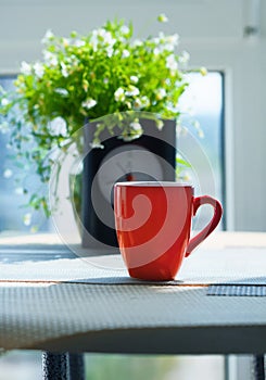 Bouquet of wildflowers and cup