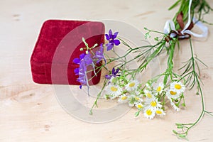 Bouquet of wildflowers with a gift box