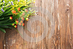 Bouquet of wildflowers on wooden. Wild flowers on an old wooden background