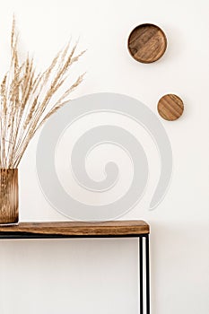 Bouquet on the wooden console table.