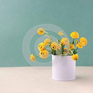 Bouquet of yellow flowers in a bank. Floral decoration. Spring and summer time minimal close up.