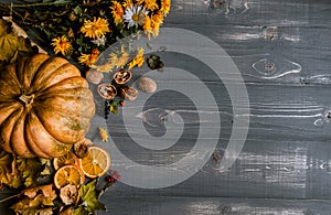 Bouquet of yellow and orange flowers on a white wooden table