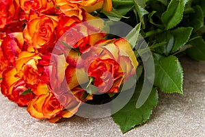 Bouquet of yellow and red roses photo