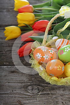 Bouquet of yellow and red tulips and easter eggs