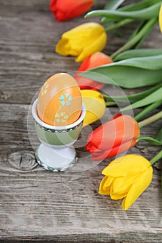 Bouquet of yellow and red tulips and easter eggs