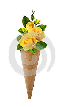 Bouquet of yellow rose flowers in a craft paper cornet