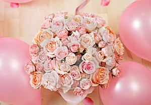 Bouquete of flowers pink roses and balloons photo