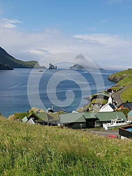The Bour village with Drangarnir and Tindhólmur Islands in background, Vágar, Faroe Islands
