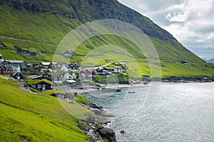 Bour village. Typical grass-roof houses and green mountains. Vagar island, Faroe Islands. Denmark. Europe photo