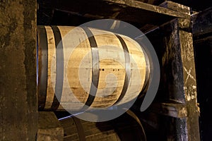 Bourbon barrels aging in a distillery warehouse