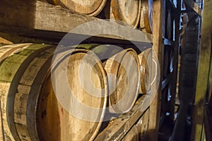 Bourbon barrels on rack in warehouse