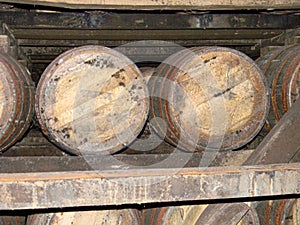 Bourbon barrels on racks in a rickhouse