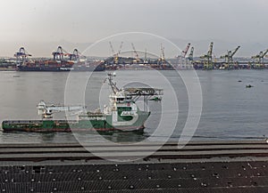 The Bourbon Pearl departing the Old Port of Rio, the Porto Maravilha, with a Container Ship moored alongside.