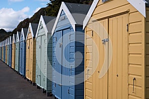 Colourful beach huts located on the promenade on the Bournemouth UK sea front.