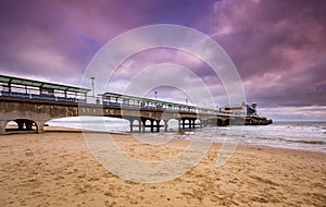 Bournemouth pier illuminated by the setting sun at sunset