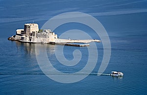 Bourtzi Venetian water fortress in Nafplio, Peloponnese, Greece photo