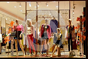 Boutique window,Fashion clothing store,Fashion store window in shopping mall,dress shop window taken at night