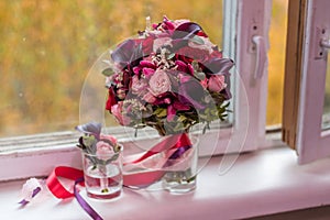 Boutonniere and the bride`s bouquet