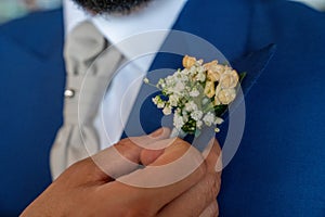 boutonniere detail of the groom's suit