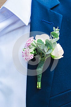 Boutonniere on the groom jacket