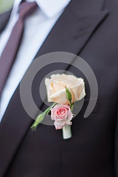 Boutonniere on groom`s wedding jacket